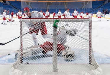 BUFFALO, NEW YORK - DECEMBER 26: Belarus goalie Andrei Grischenko #20 warms-up prior to a game against Switzerland during the preliminary round of the 2018 IIHF World Junior Championship. (Photo by Andrea Cardin/HHOF-IIHF Images)

